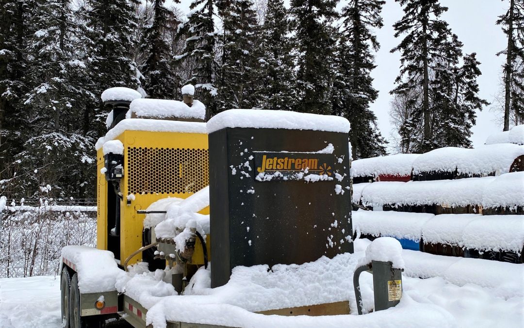 Waterblasting unit outside in the snow, demonstrating the need for winterizing waterblasting equipment in freezing conditions